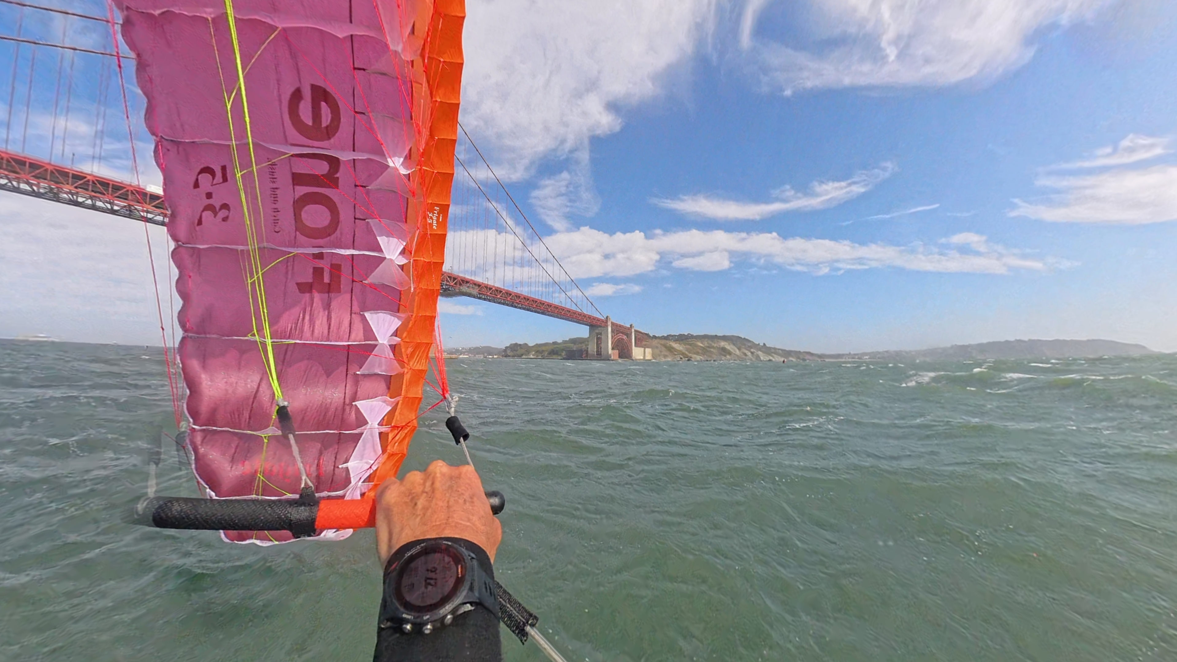 Rider flying a parawing at the Golden Gate Bridge